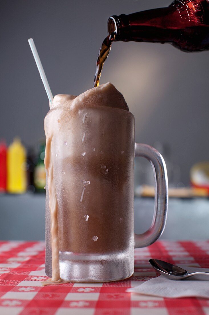 Root Beer Pouring into a Root Beer Float