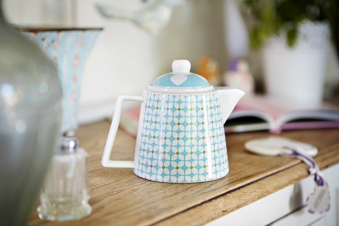 A porcelain teapot in a kitchen