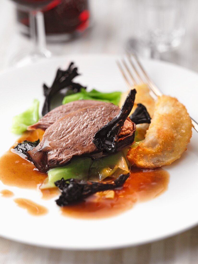 Braised beef with dried mushrooms and potato cakes