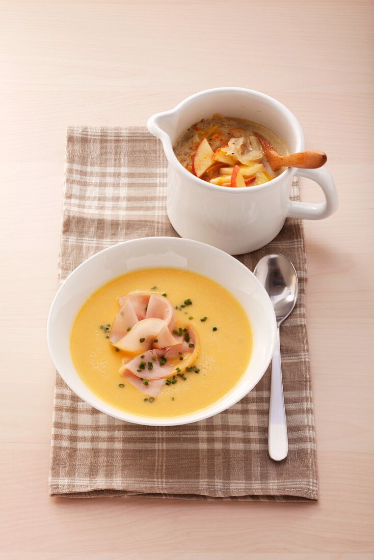 Sauerkraut soup with apple and pumpkin soup with chicken breast