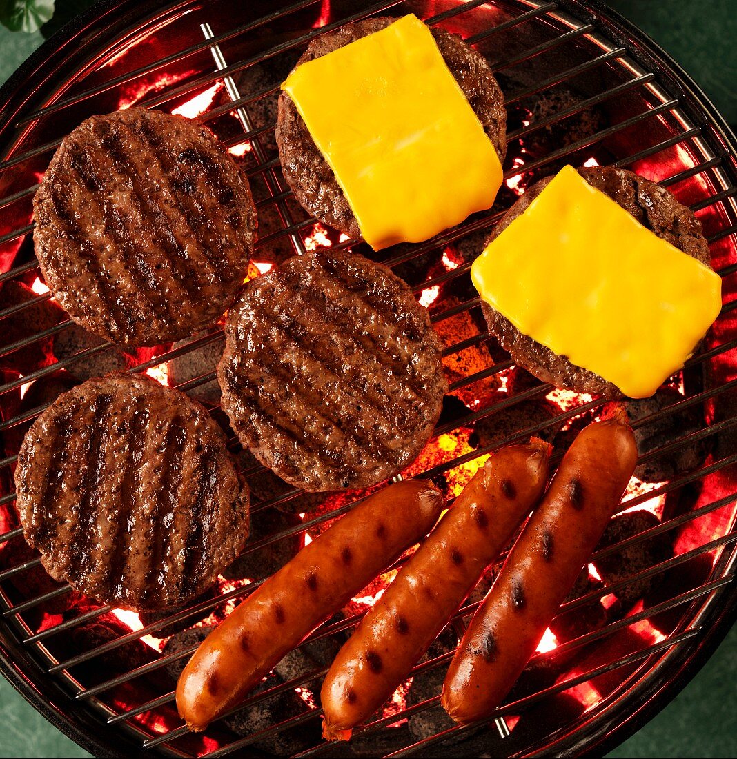 Hamburgers, Cheeseburgers and Hot Dogs on a Grill; From Above