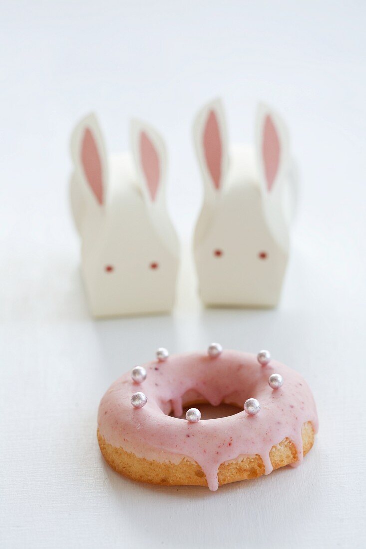 A doughnut and Easter bunnies made from paper