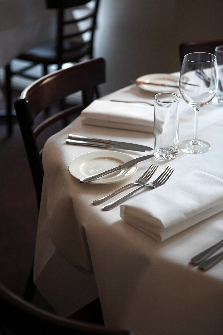 A classically laid round table in a restaurant