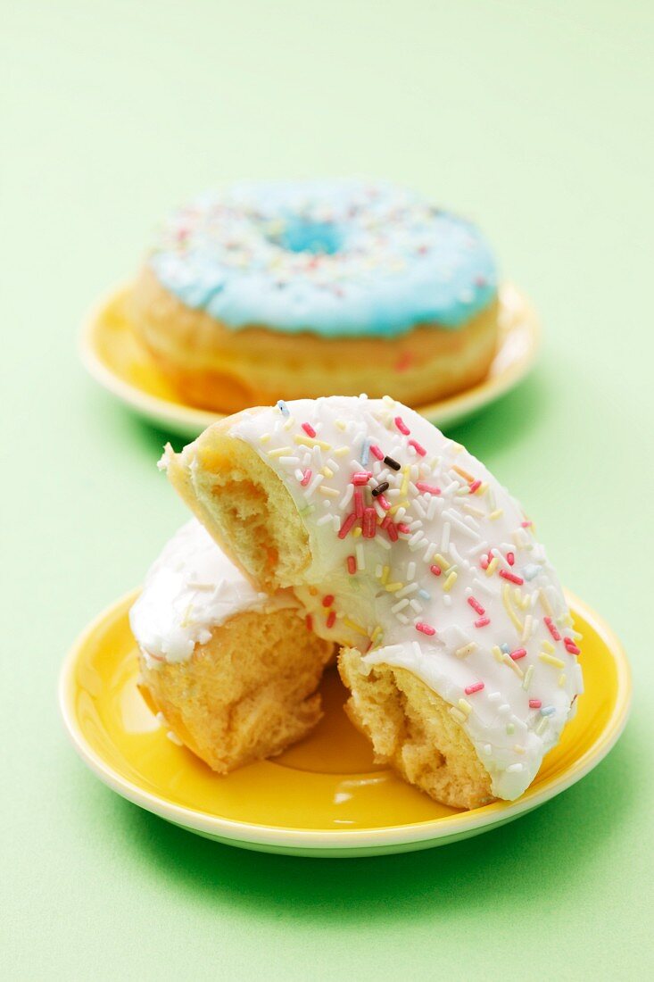 An iced doughnut with sugar sprinkles