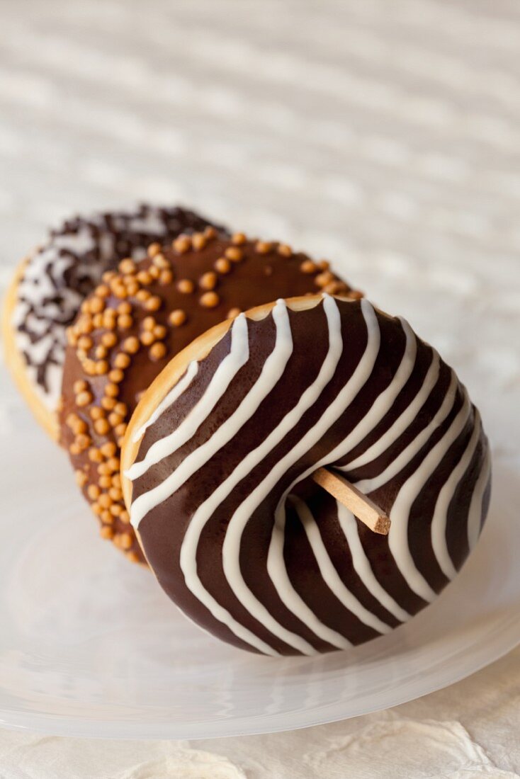 Doughnuts with chocolate glaze and icing sugar