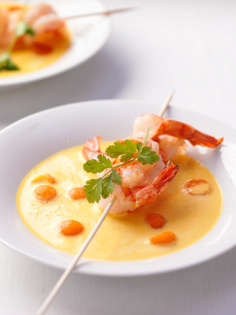 Pumpkin soup with prawn skewer