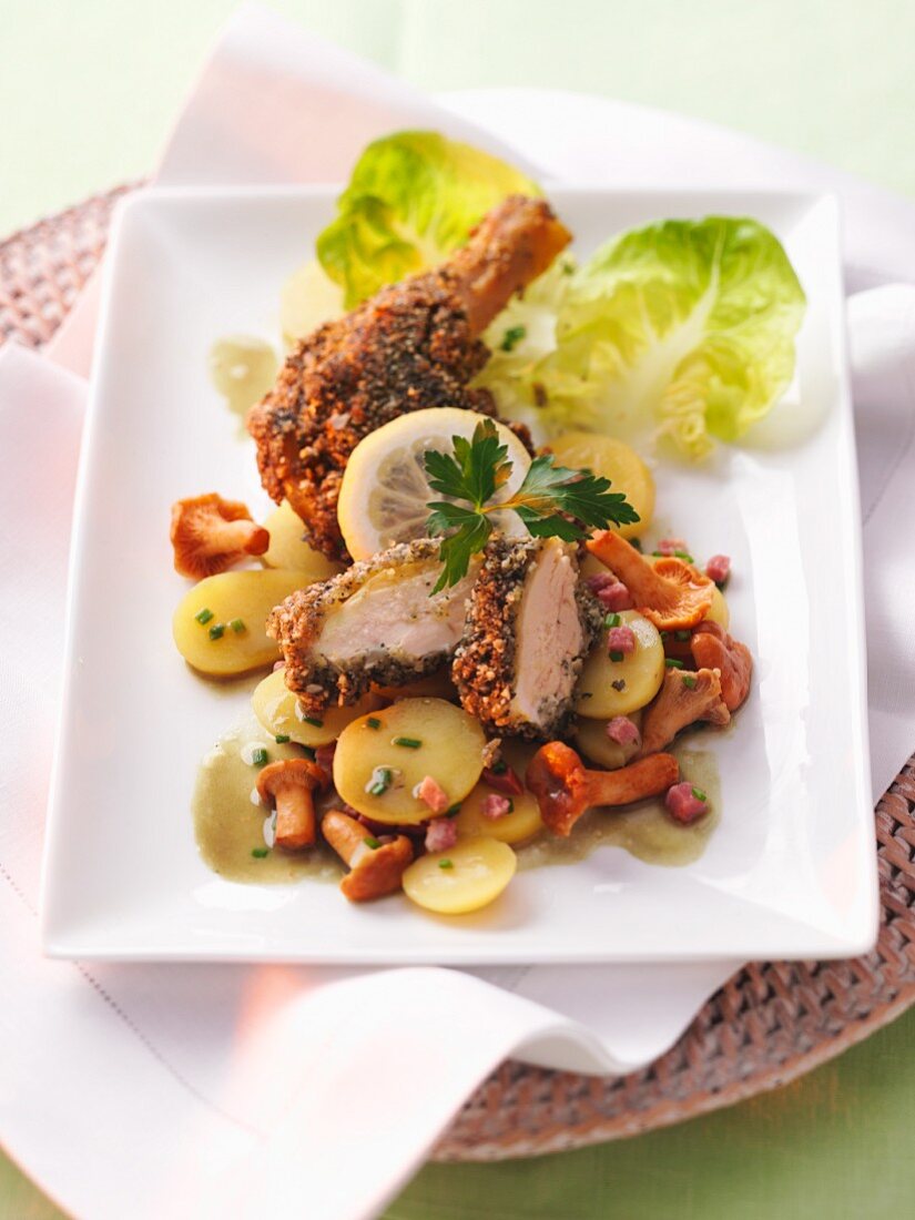 Spring chicken on a potato and chanterelle mushroom salad