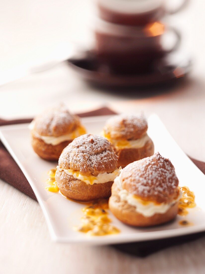 Profiteroles with passion fruit sauce