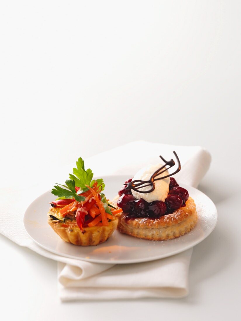 A vegetable tartlet and a cherry tartlet