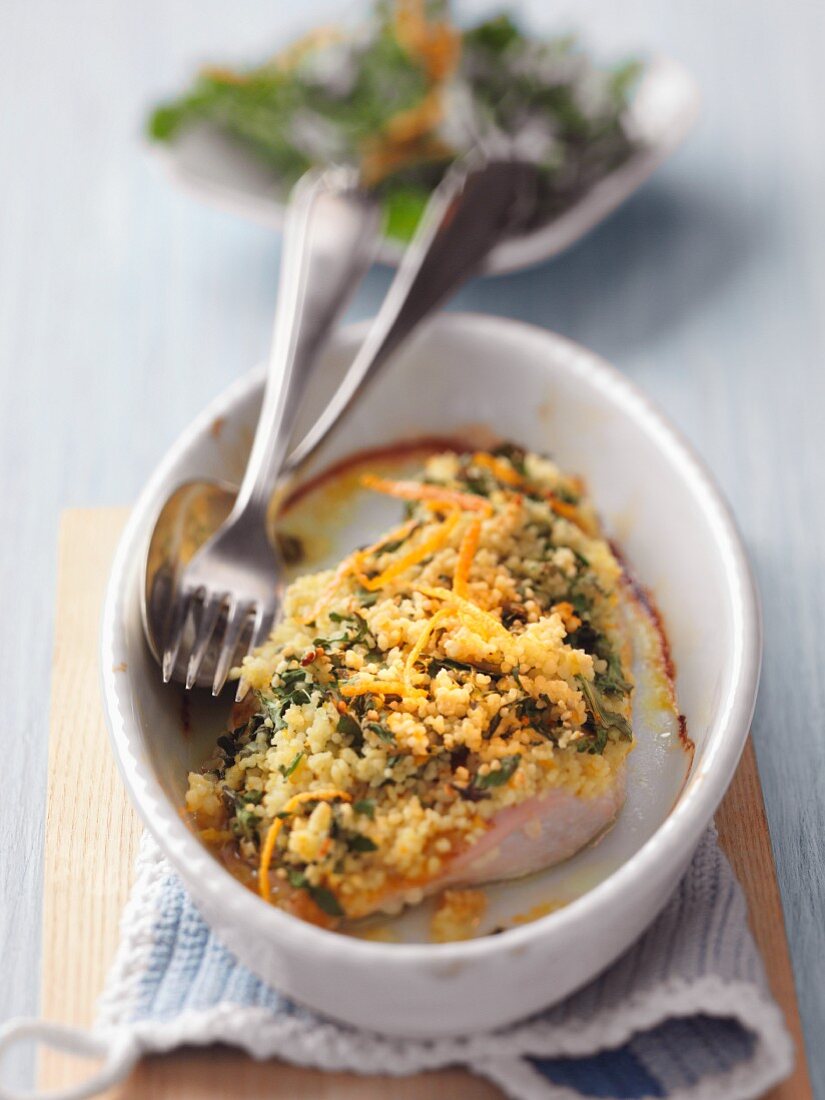 Turkey steak au gratin with rocket and orange zest