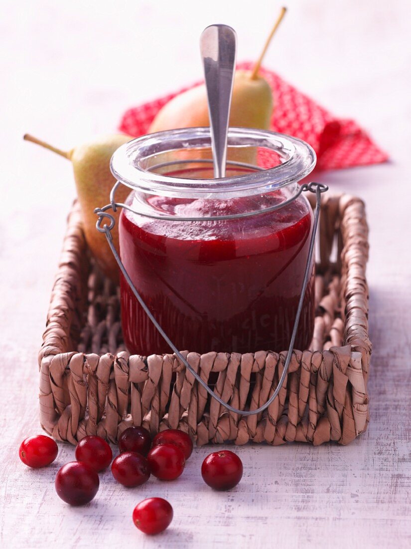 A jar of cranberry and pear jam