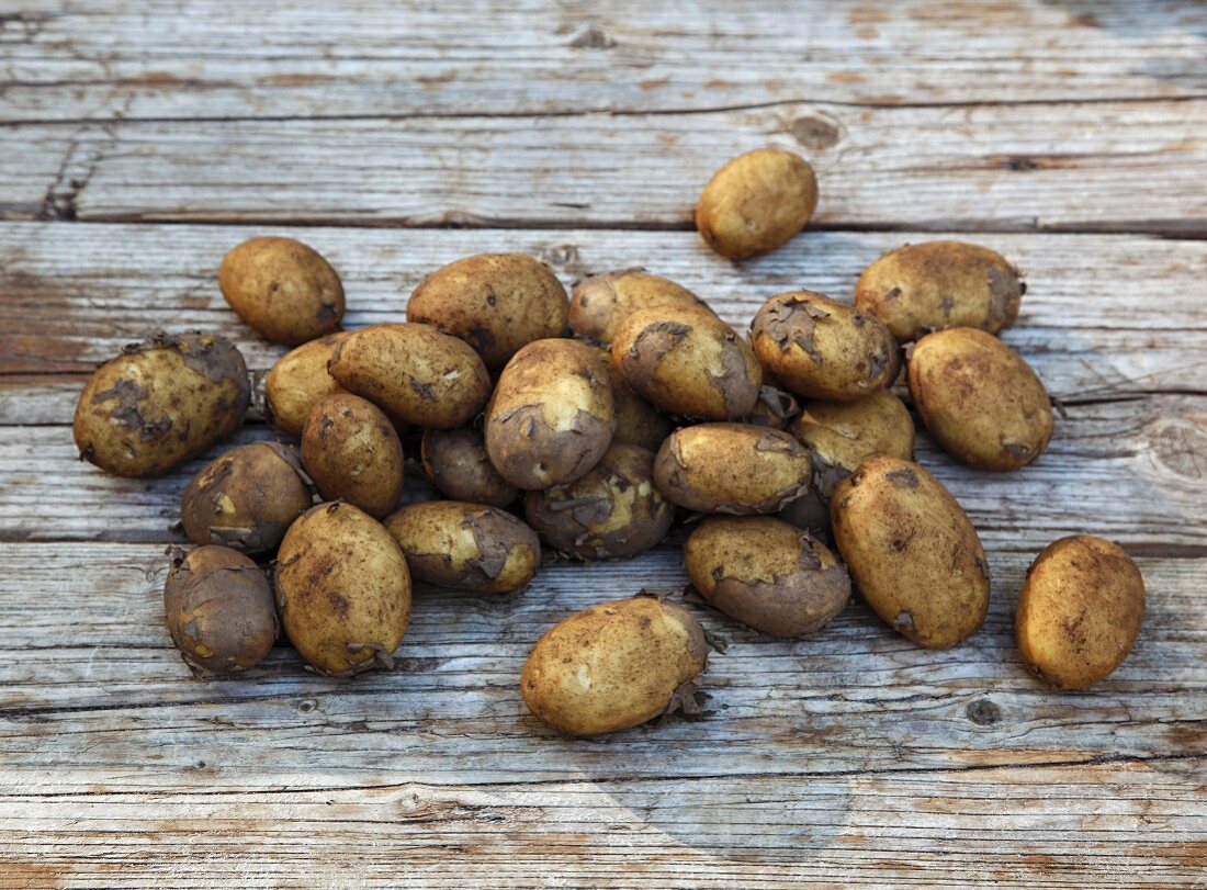 Potatoes on wooden background