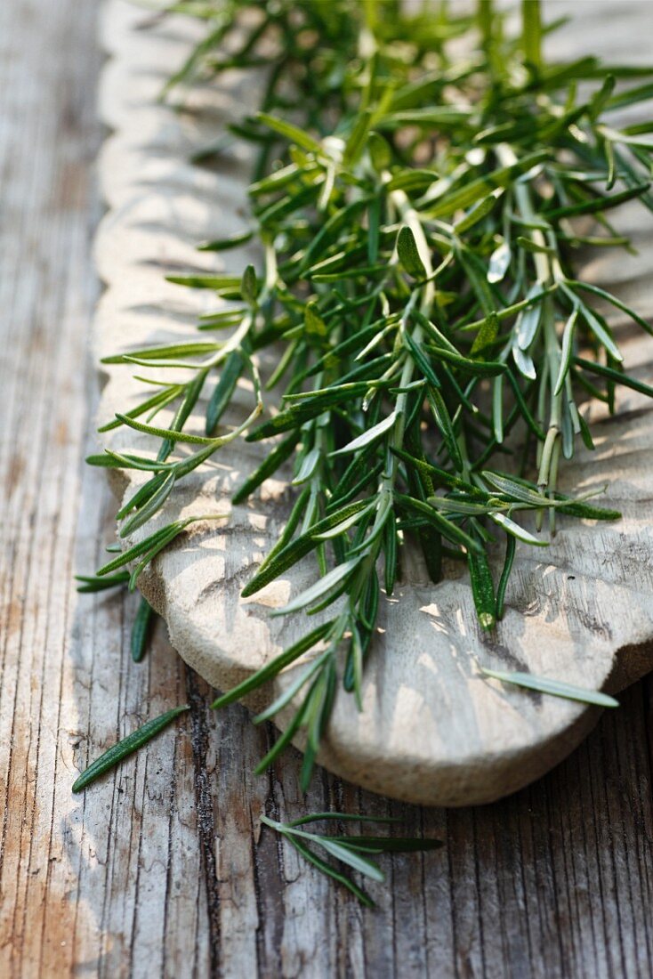 Fresh rosemary in a wooden bowl