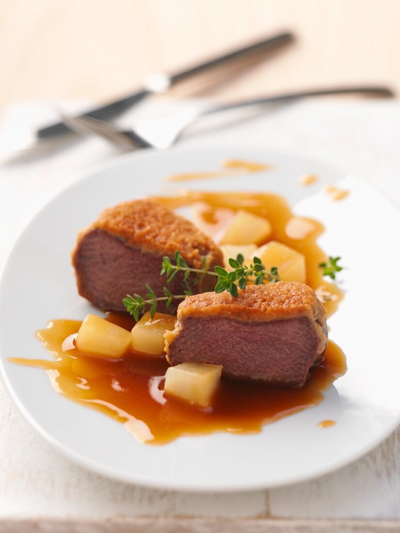 Venison steak with an almond crust with pears
