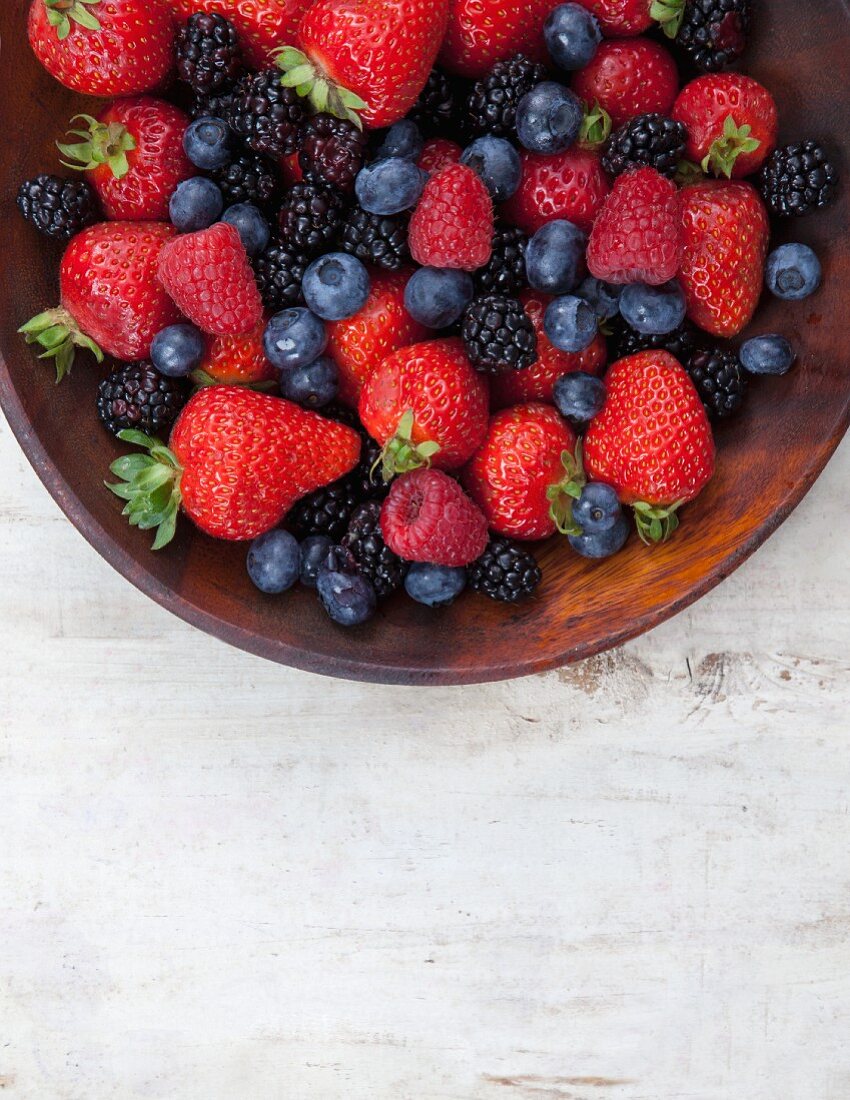Mixed Berries in a Wooden Bowl; From Above
