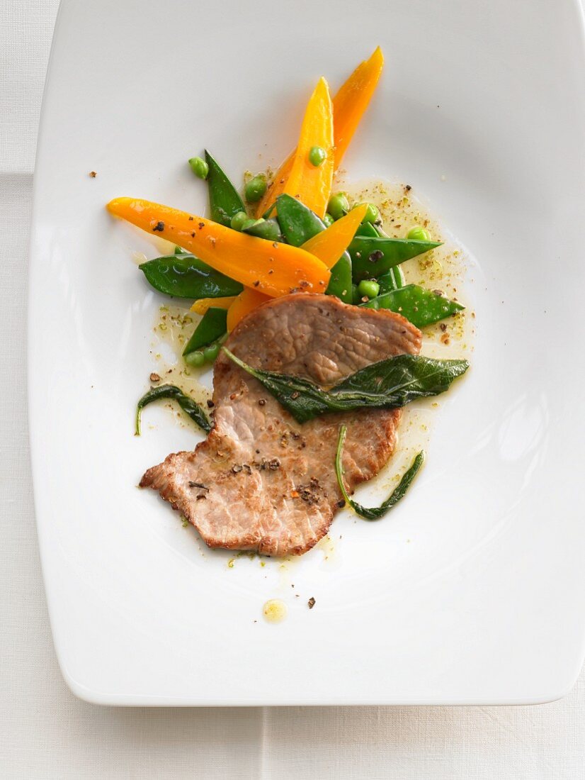 Veal escalope with sage, carrots and mange tout