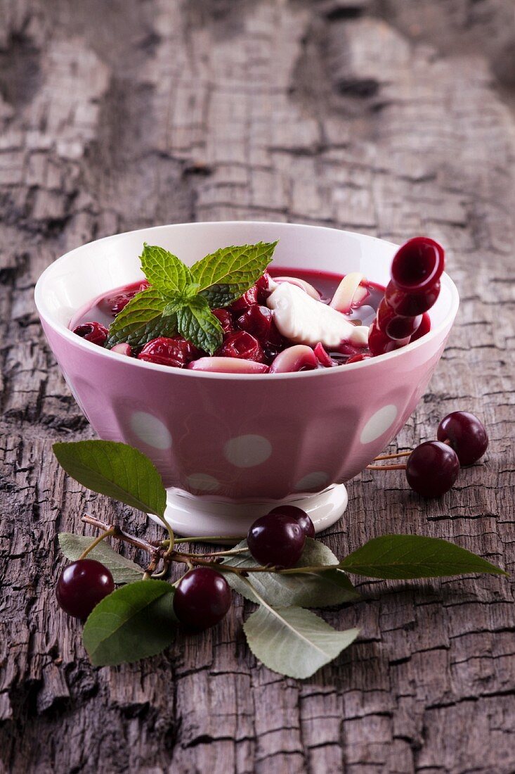 Cherry soup with pasta, sour cream and peppermint