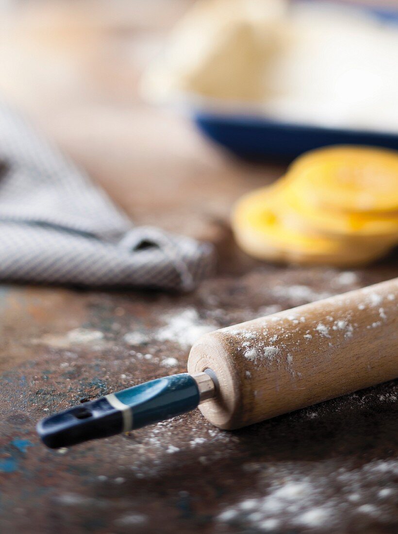 A still life featuring a rolling pin
