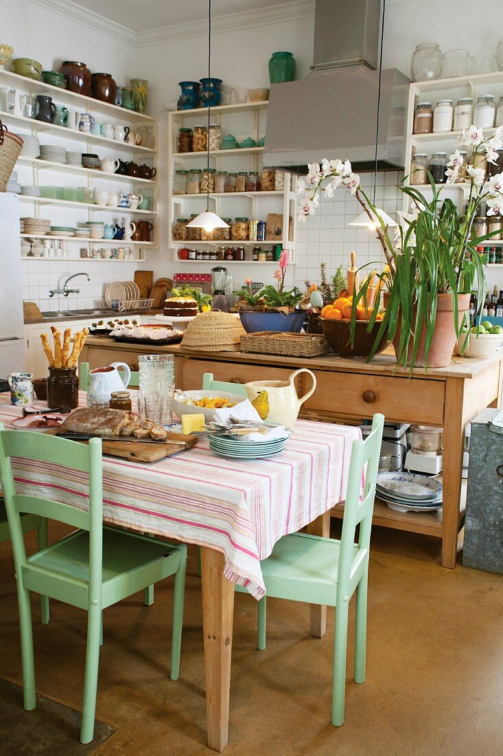 A kitchen-diner in the country with preparations for a meal