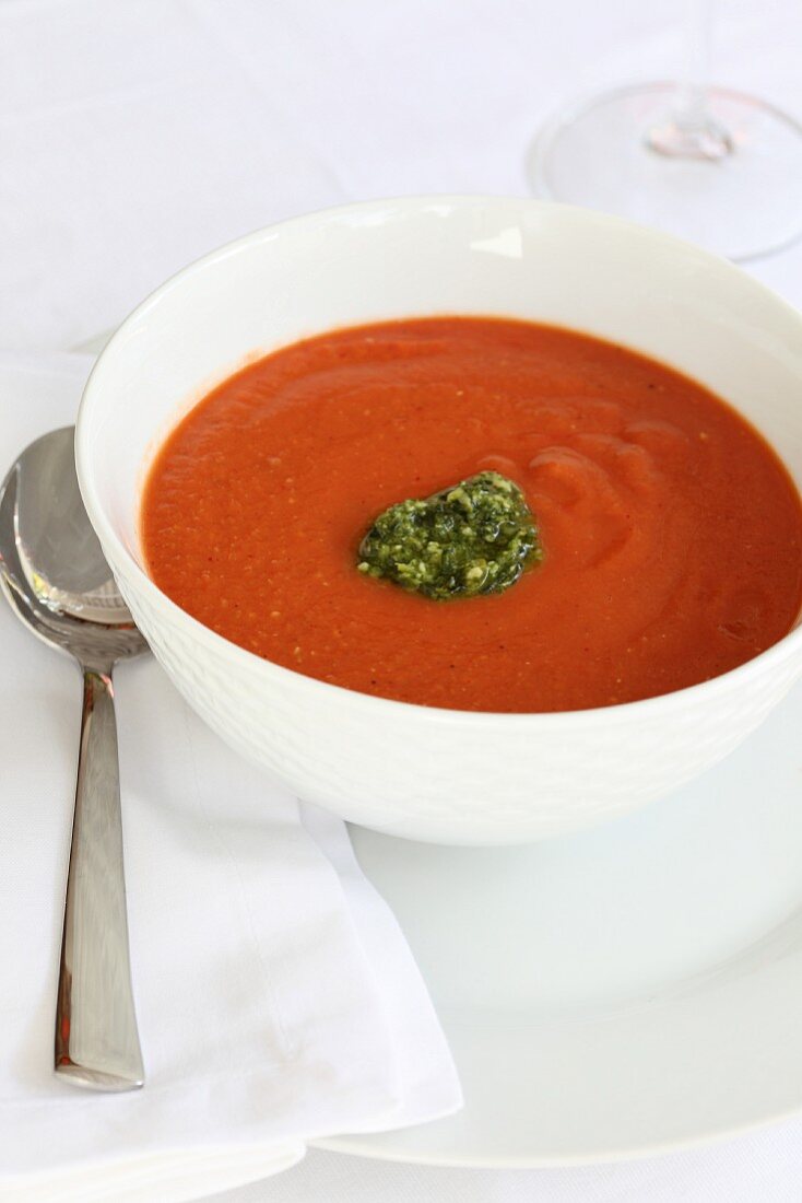 Cream of tomato soup with basil pesto