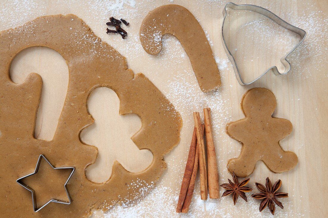 Gingerbread Man and Candy Cane Cut From Cookie Dough; Star Cookie Cutter