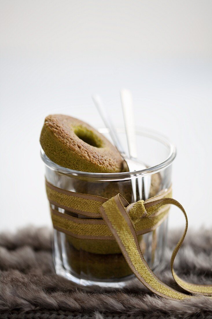 Doughnuts with green tea in a glass