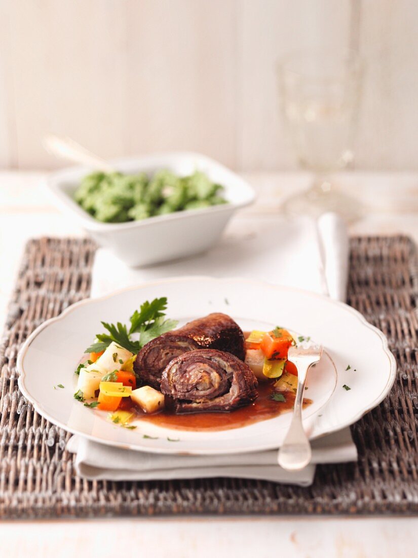 Beef roulade with a side of vegetables