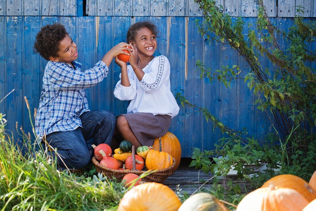 Children playing with pumpkins