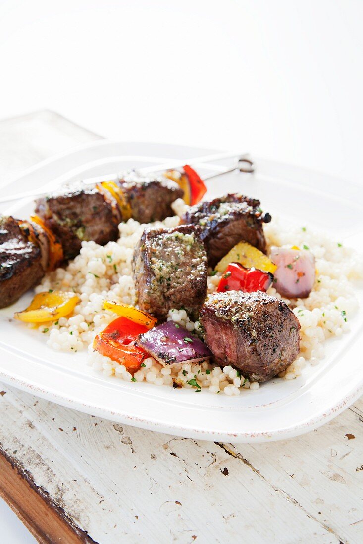 Beef Kabobs with Onions and Peppers Over Israeli Couscous
