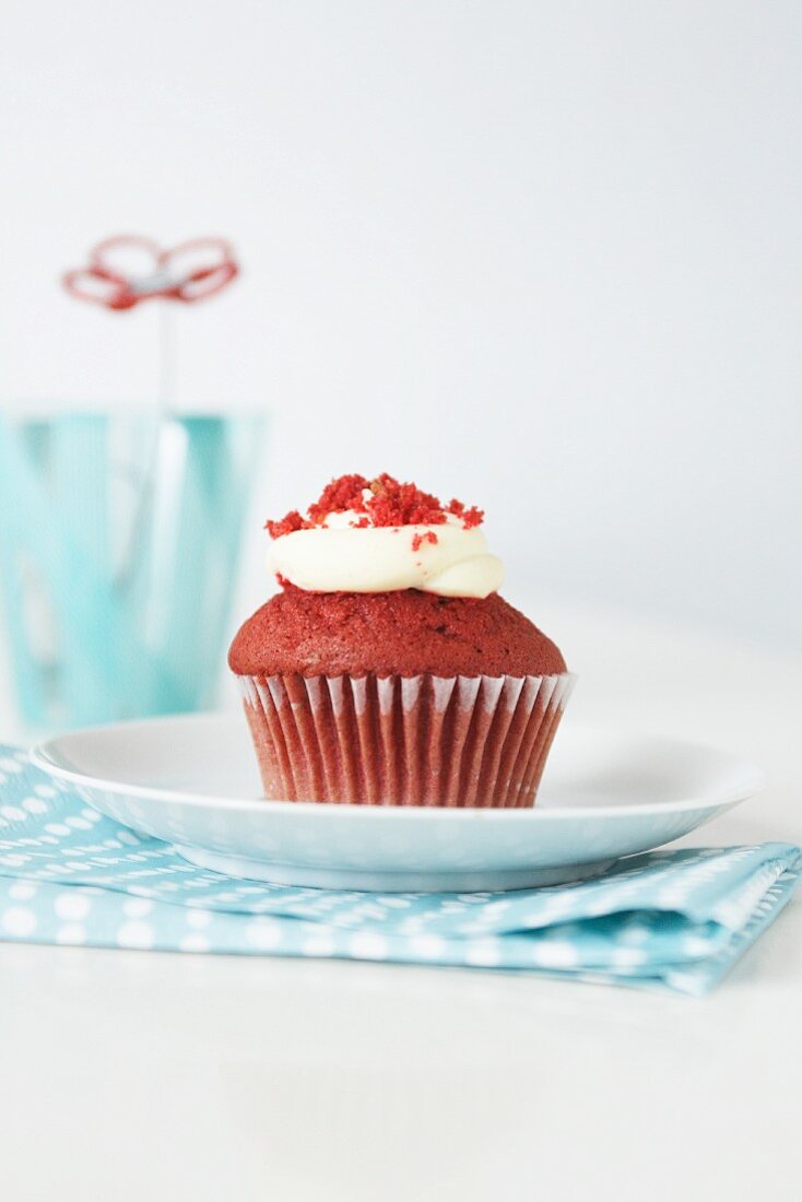 A red velvet cupcake with cream