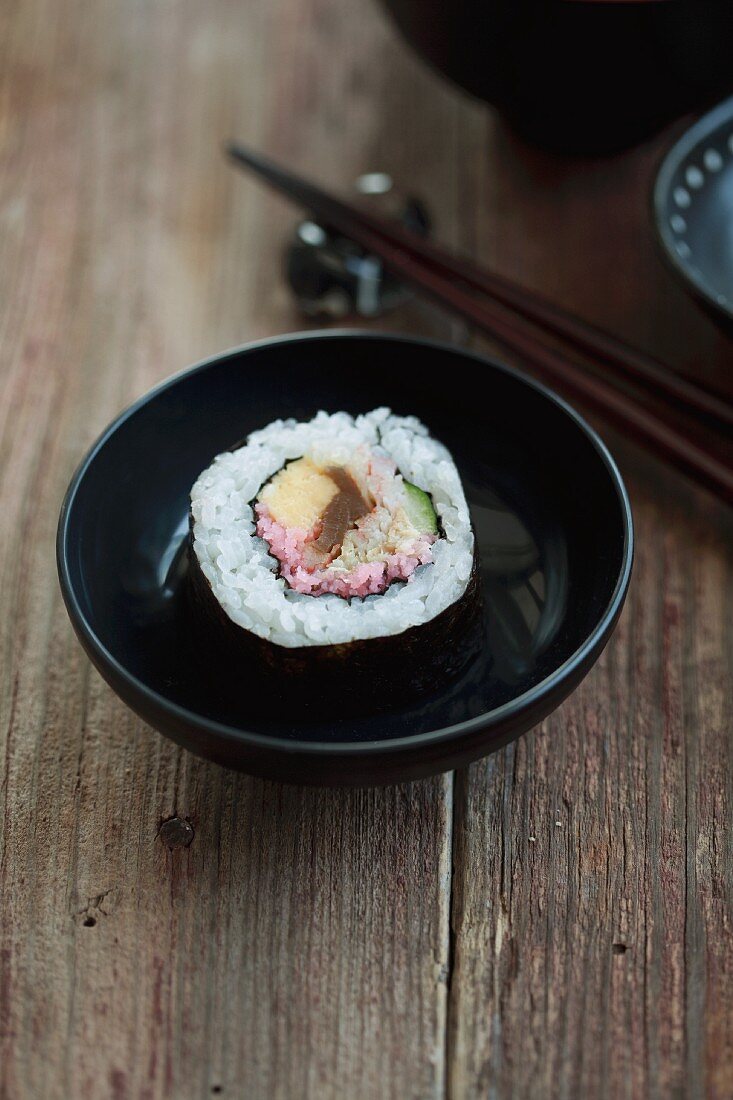 Maki sushi with tuna, egg, cucumber and crab