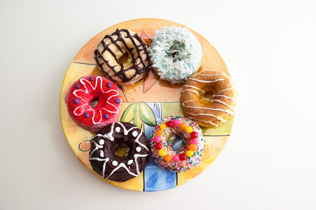 An Assortment of Doughnuts on a Round Plate; From Above