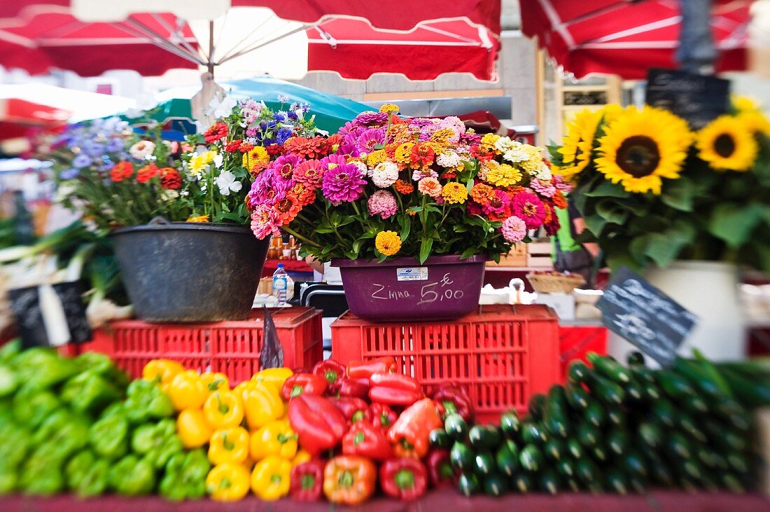 Flowers and vegetables on a market stall