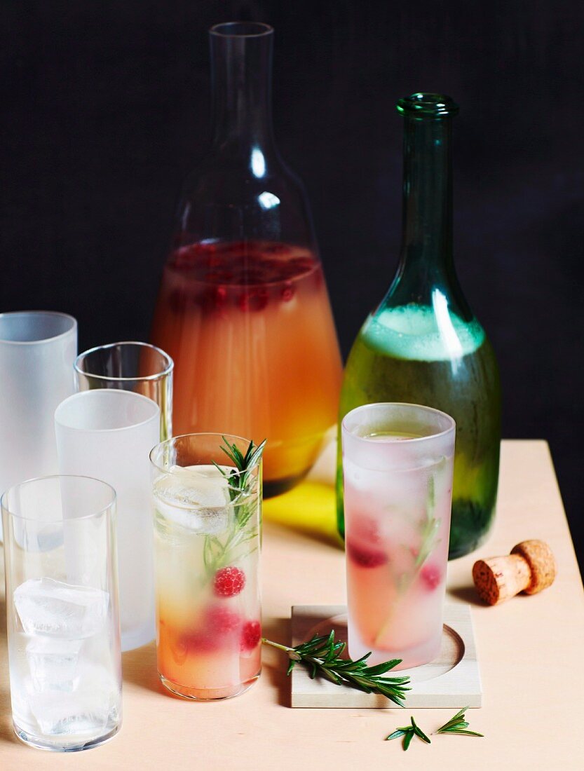 Cocktails with gin, honey, naked barley and raspberries