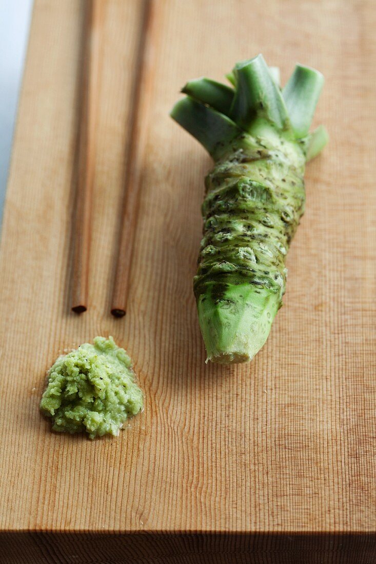 Wasabi, whole and grated, with chopsticks