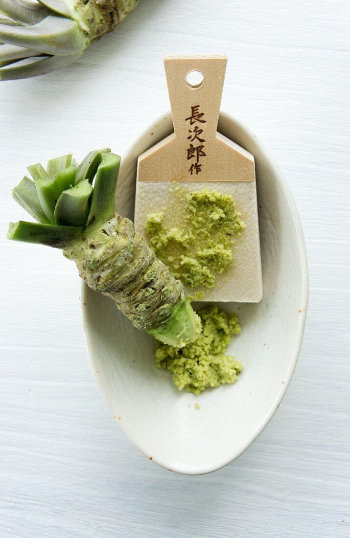 A wasabi root and a traditional grater made of whale skin