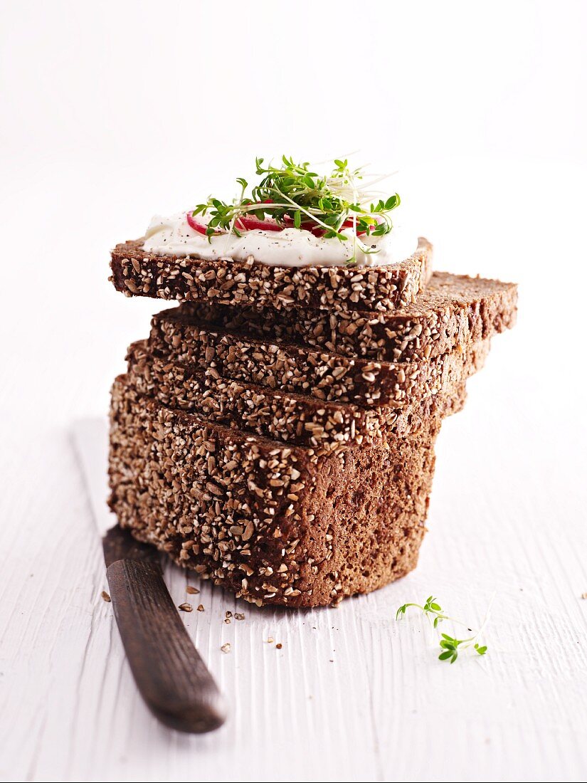 Black bread with quark and radishes