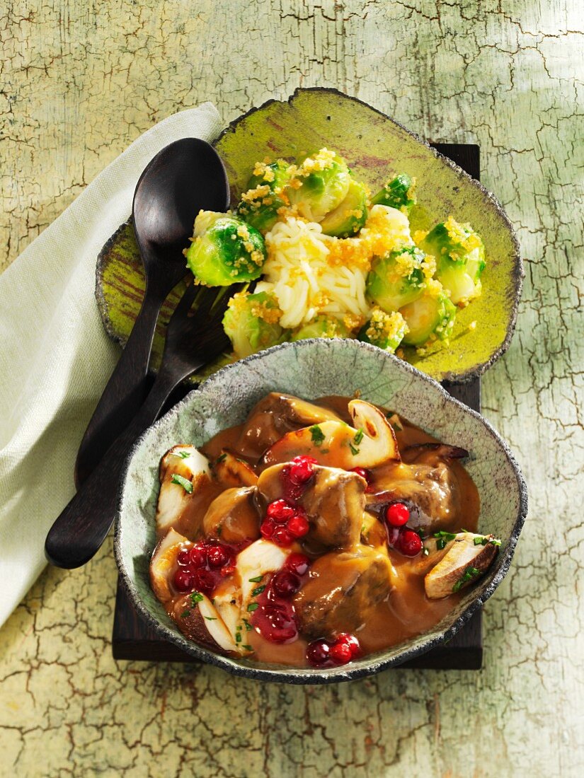 Venison goulash with porcini mushrooms, lingonberries and Brussels sprouts