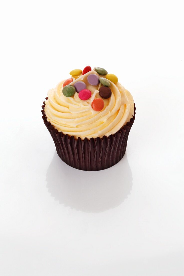 Cupcake with coloured chocolate beans