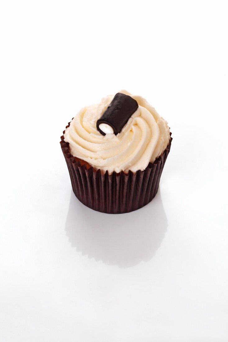 A cupcake decorated with a liquorice bonbon