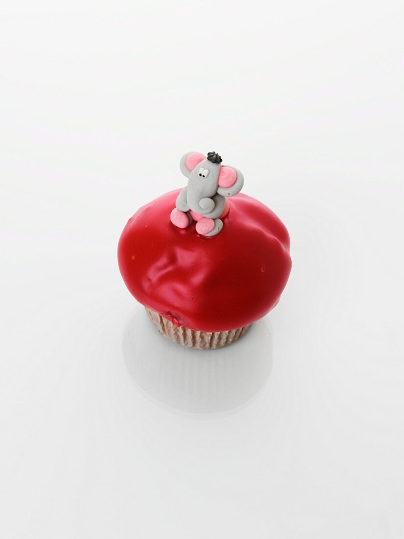 A cupcake decorated with an elephant