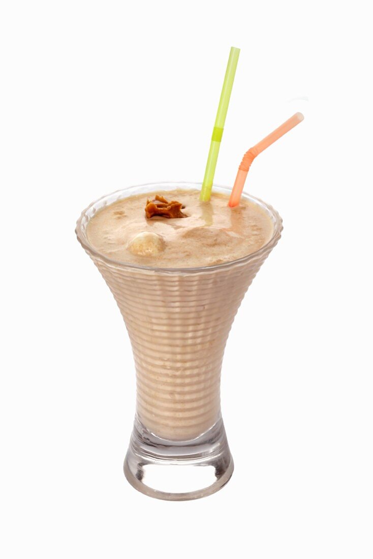 A caramel shake with two straws