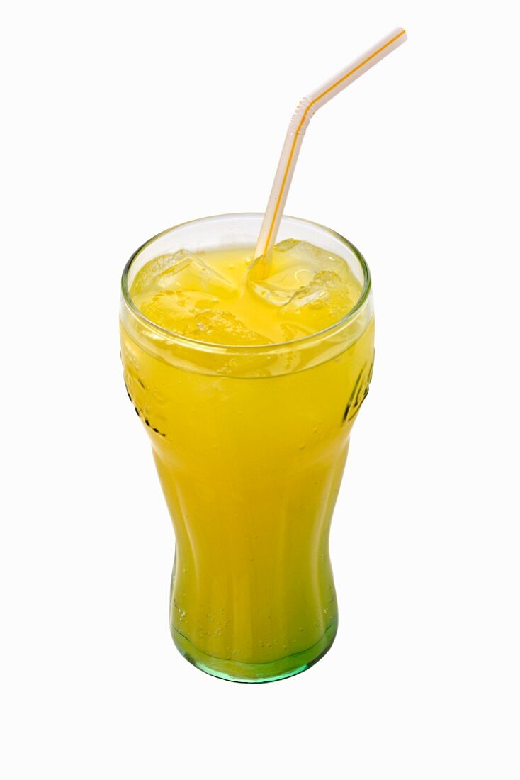 A glass of orangeade with a straw