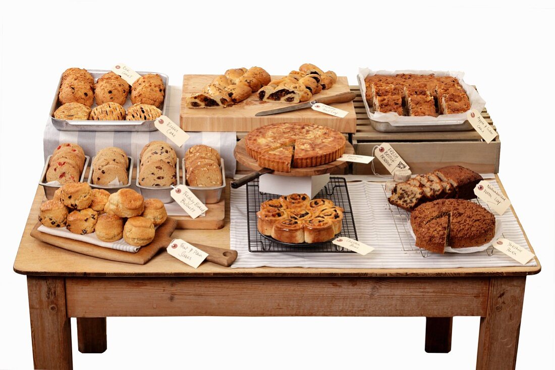 A cake buffet on a wooden table