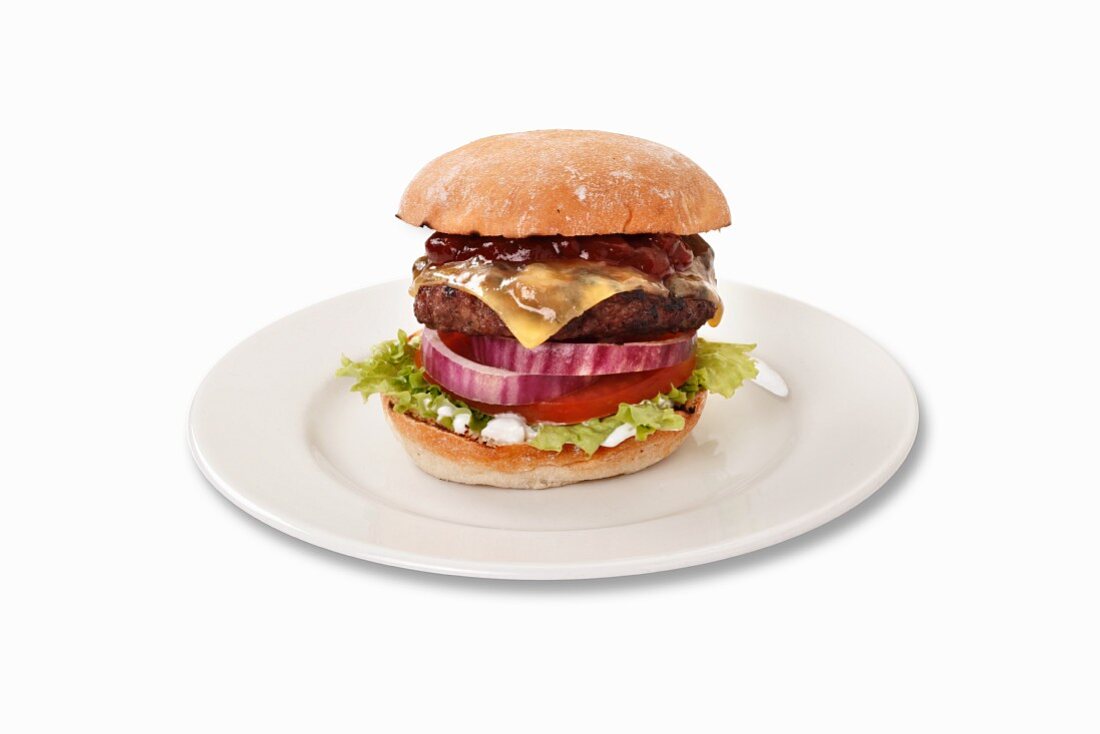 A cheeseburger with barbecue sauce