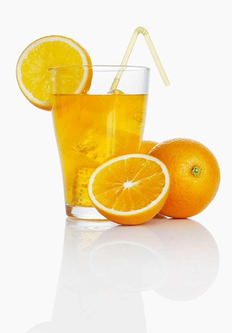 Orangeade and fresh oranges