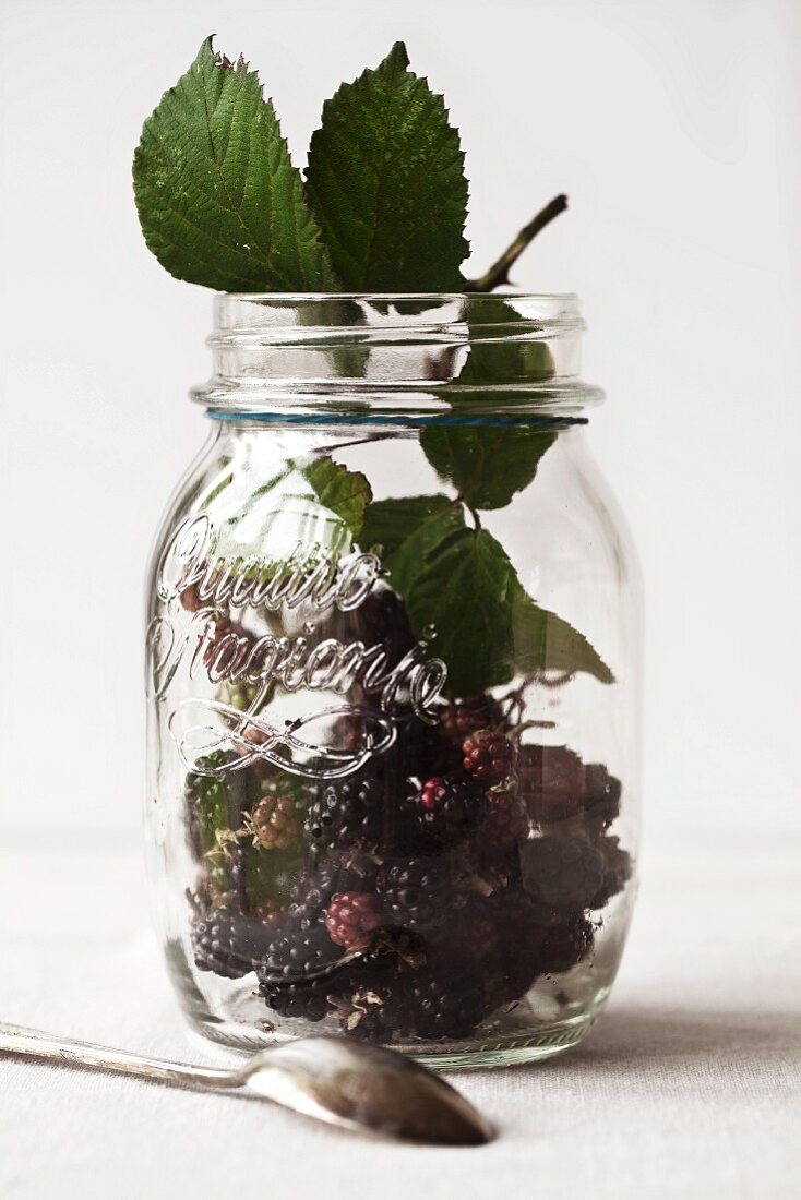 Fresh blackberries in a jar