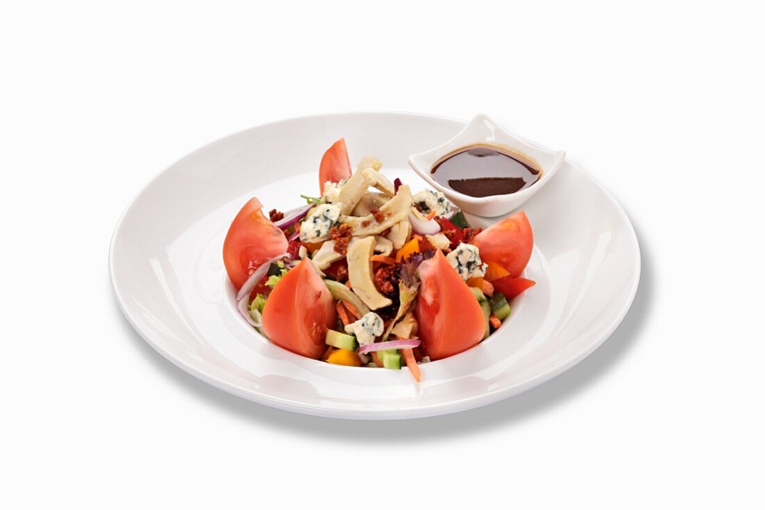 A tomato salad with blue cheese