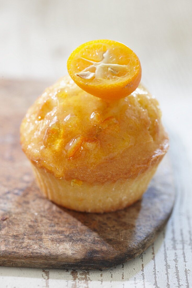 An orange muffin with kumquat
