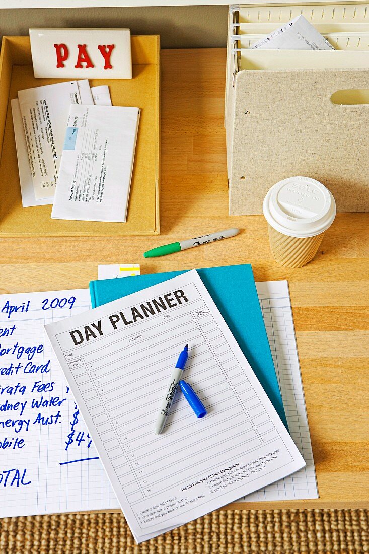 Notebook and trays on desk